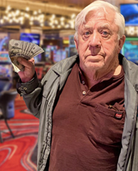 older man with cash at the casino