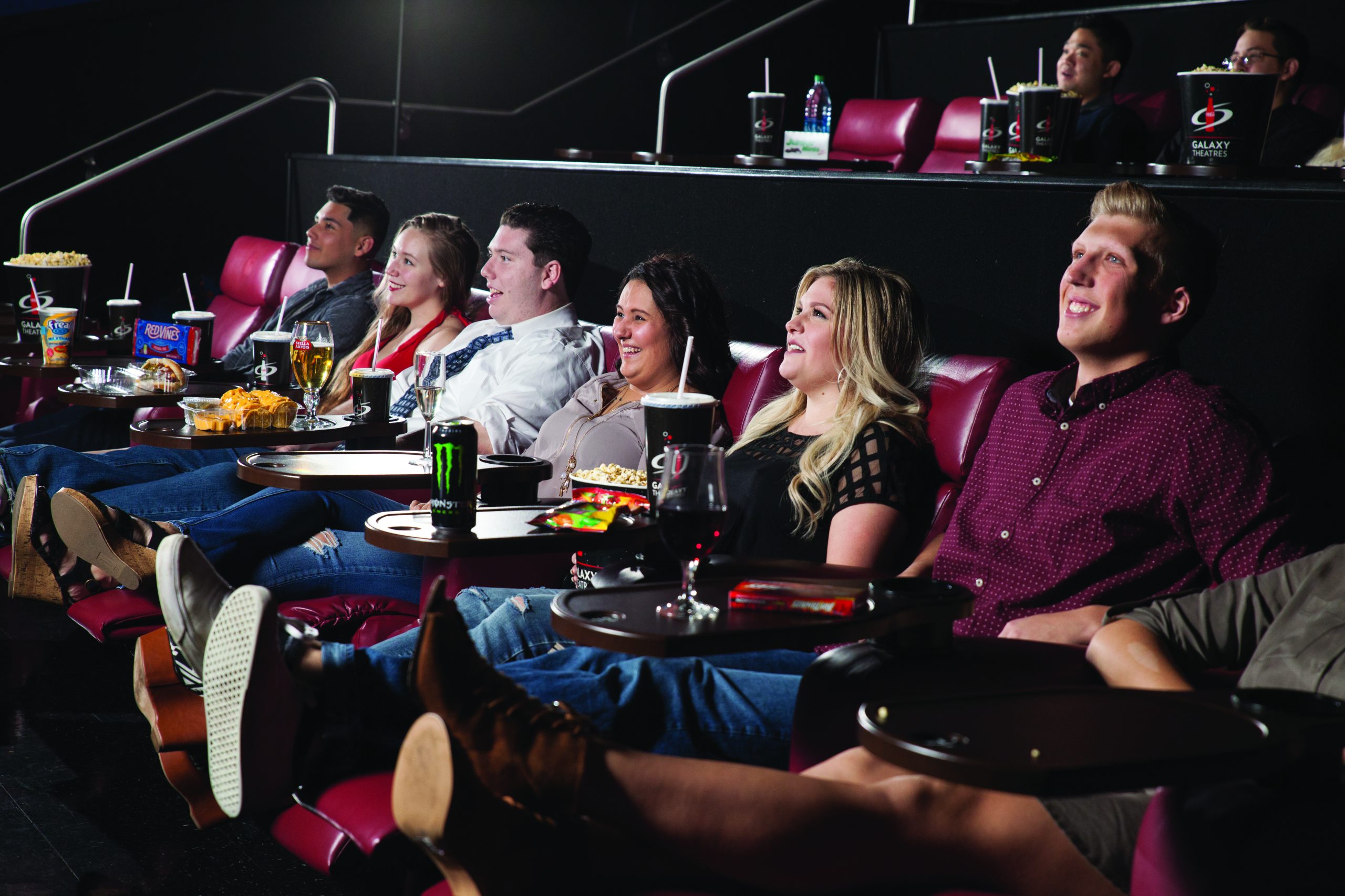 group of friends watching a galaxy theatres movie