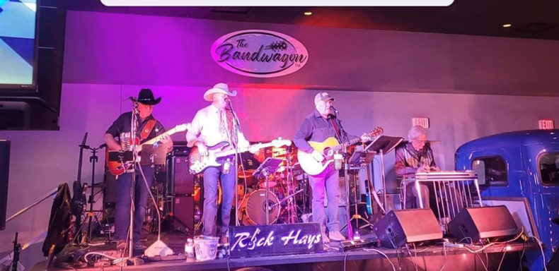 Rick Hayes and band performing at The Bandwagon's Stage